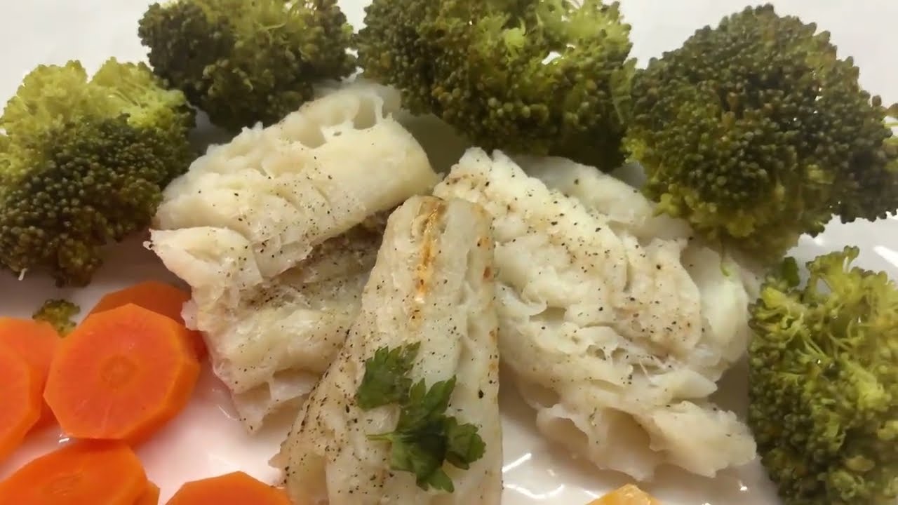 Diet food, steamed hake fish with vegetables
