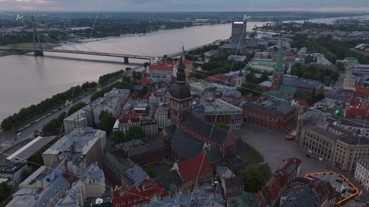 Riga Cathedral, Dome square and houses in old town. Aerial shot of historic tourist sights at dusk