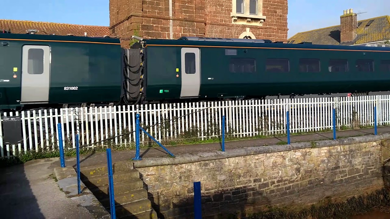 Trains. Class 802 passes Brunel's Atmospheric Railway Pumping Station at Starcross.