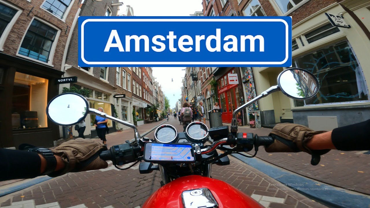 Riding the Streets of Amsterdam on motorcycle Kawasaki ER-5