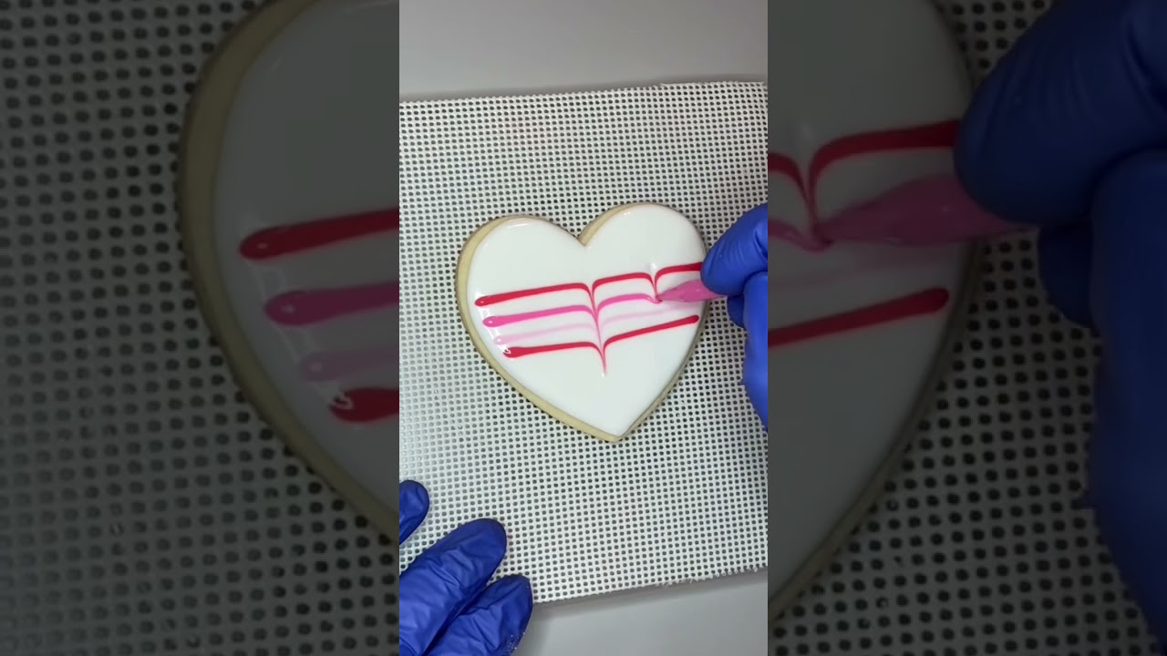 This is an easy wet on wet royal icing technique called Feathering. It&rsquo;s a beginner friendly design.