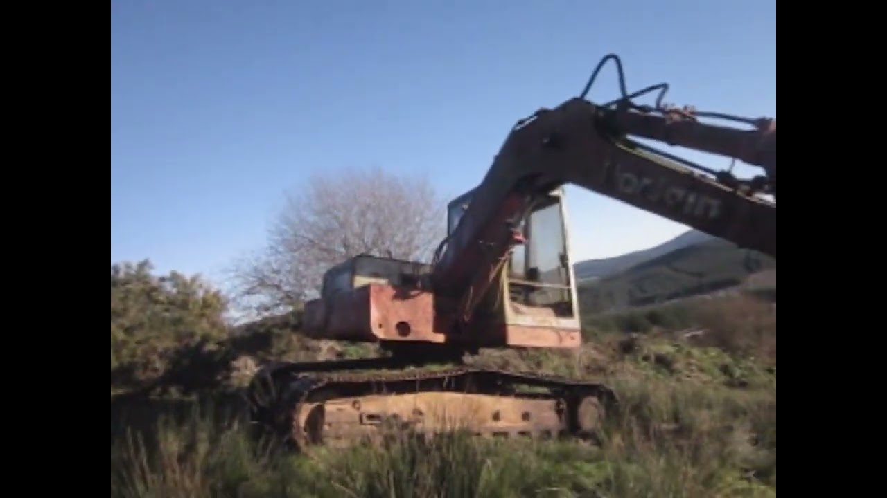 visiting a disused poclain 1984 excavator