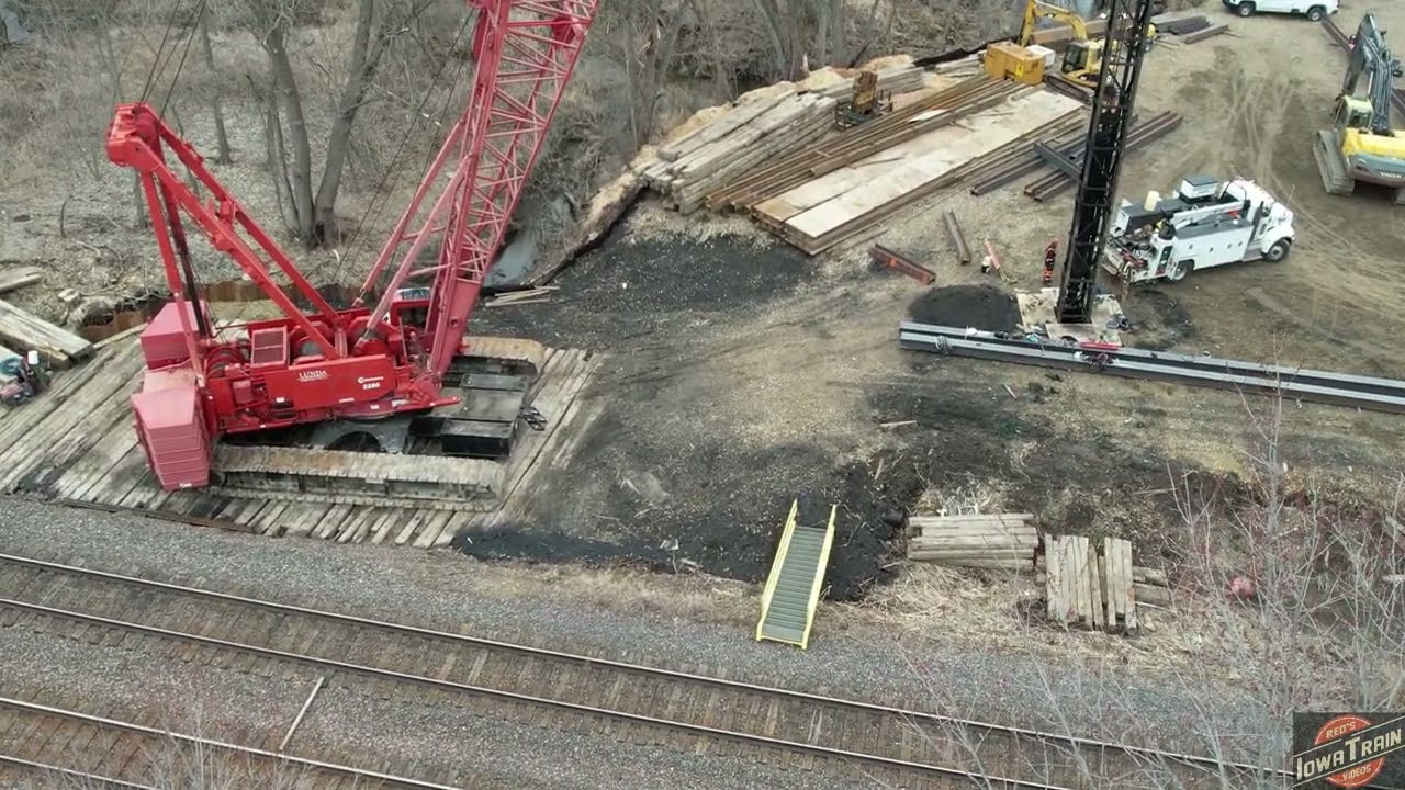 WELDING BRIDGE H PILES, Manitowoc crane and pile driver views! 6 freight trains, tamper, regulator!
