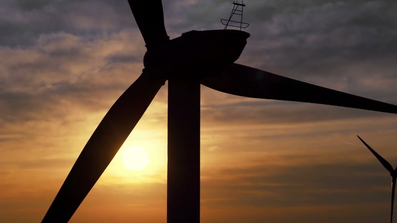 Incredible beauty of wind turbines at sunset. Carsington, Derbyshire UK. 4K