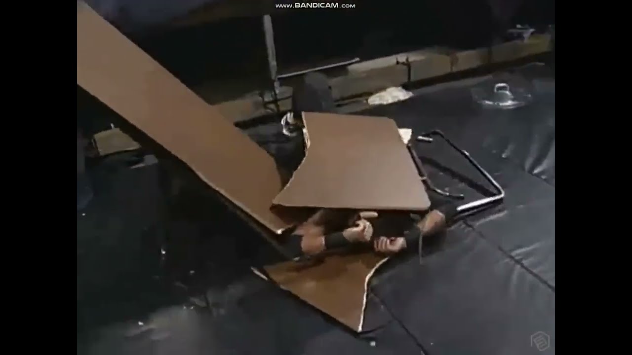 Brian Knobs powerbombs Evan Karagias through table