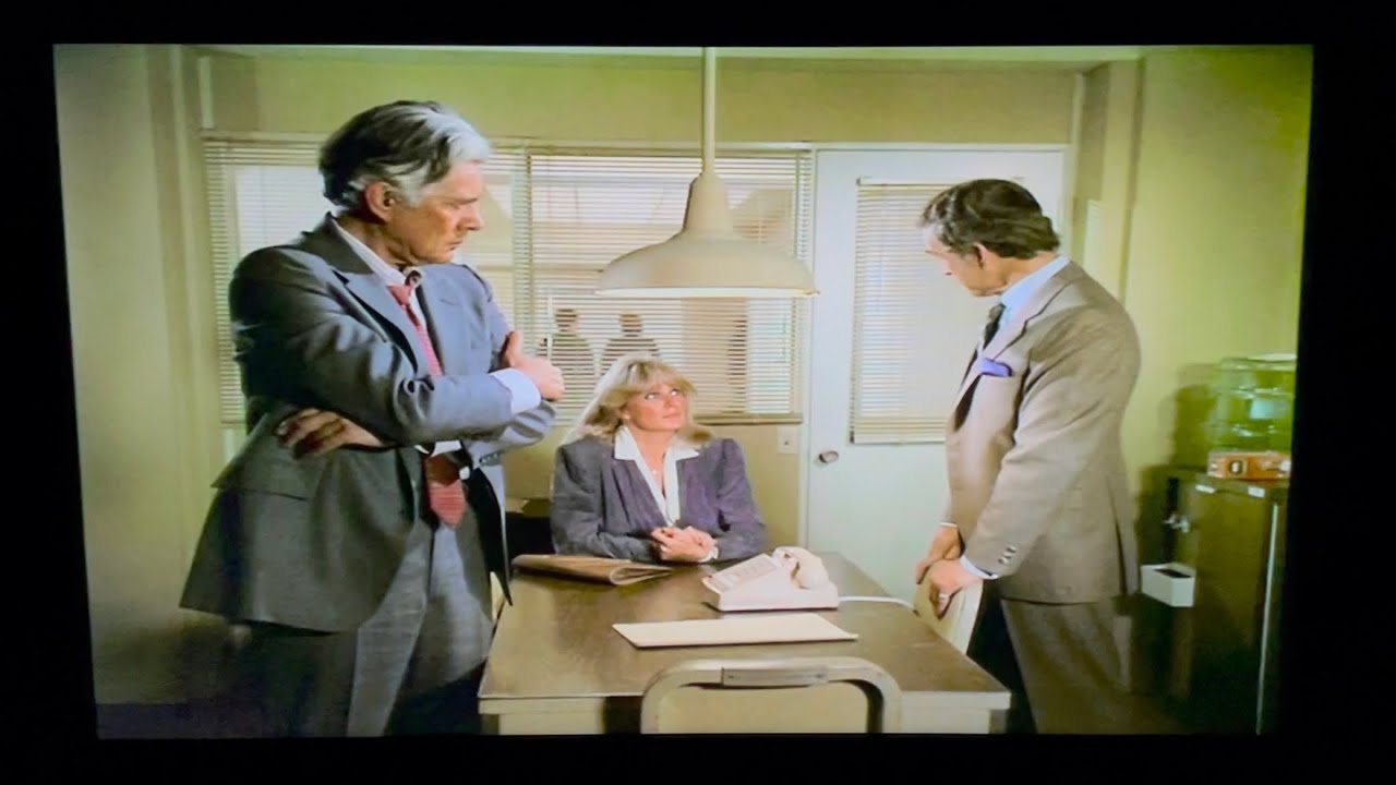 Dynasty: Blake is at police headquarters.