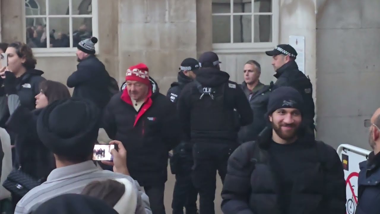 Armed police officers deal with a man trying to disrupt the o'clock inspection #kingsguard
