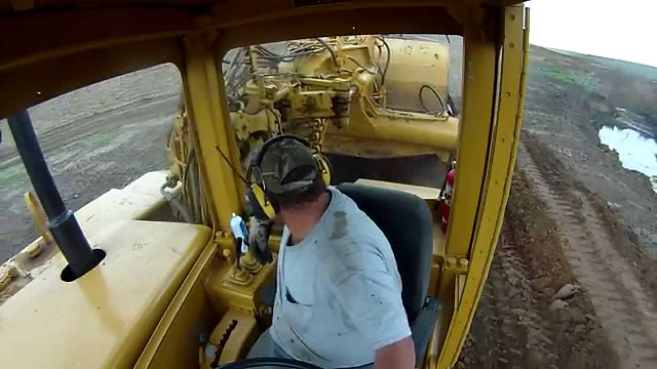Moving dirt with a motor scraper