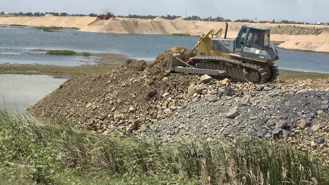 Amazing Machinery Stronger Bulldozer Vs Dump Truck Spreading Dirt Rock Building Road across the Lake