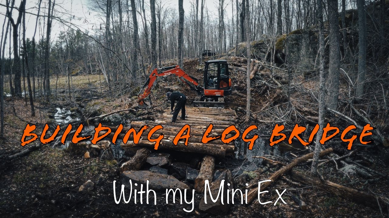 Building a Log Bridge with my Kubota Mini Excavator and Side by Side.