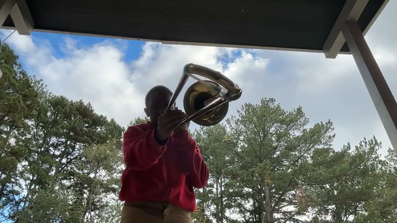Christian plays trombone