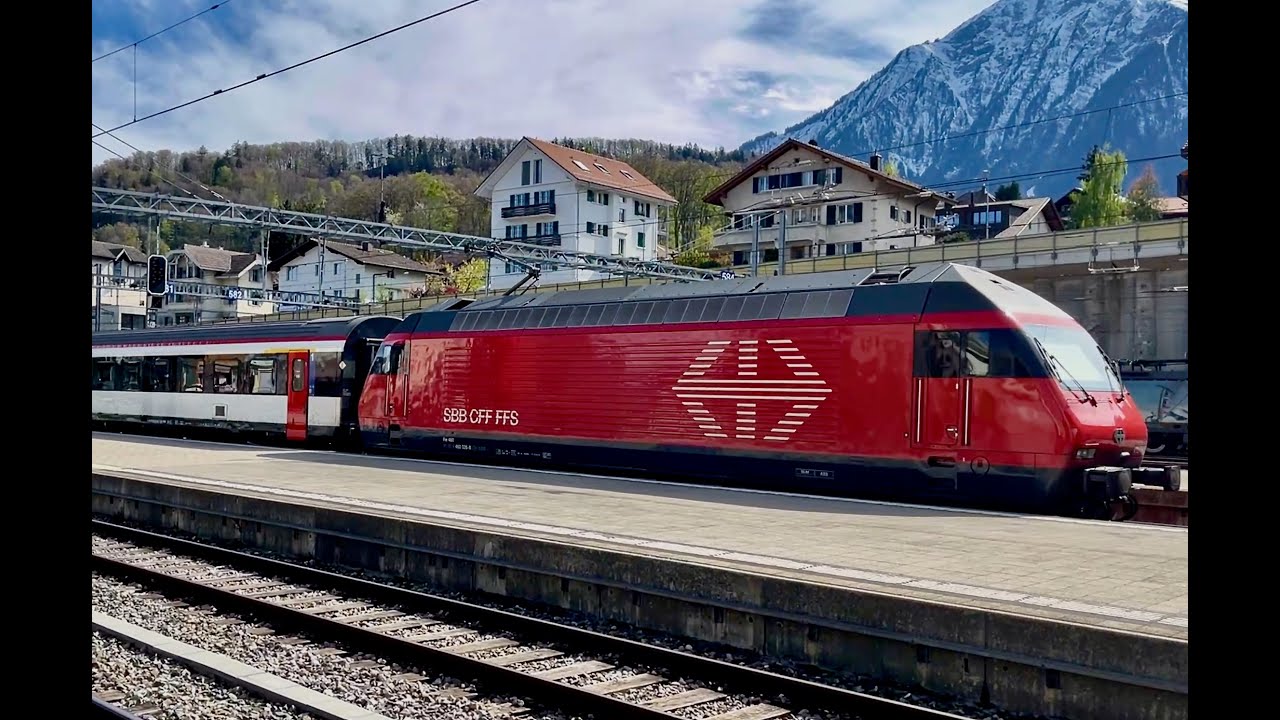 SBB CFF FFS train to Italy's Domodossola via the Simplontunnel under the Alps departs Spiez station