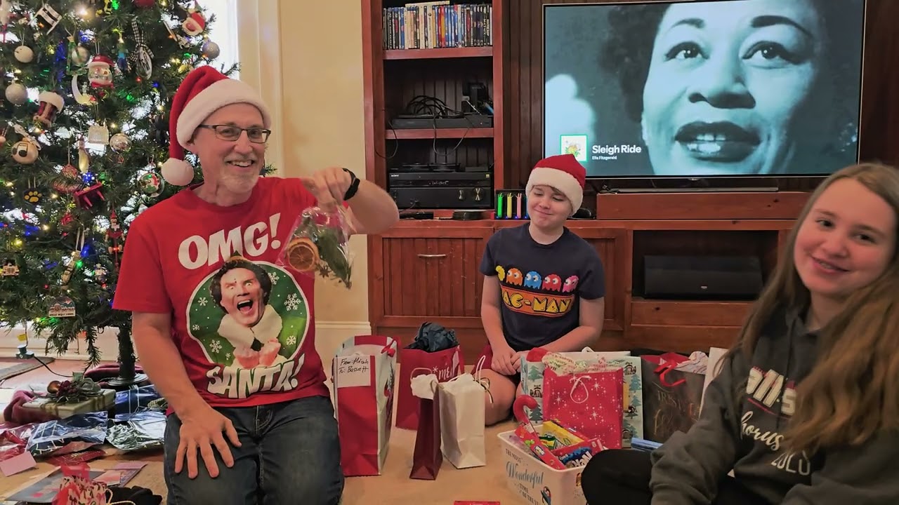 Mr  Bassett opens Christmas Gifts