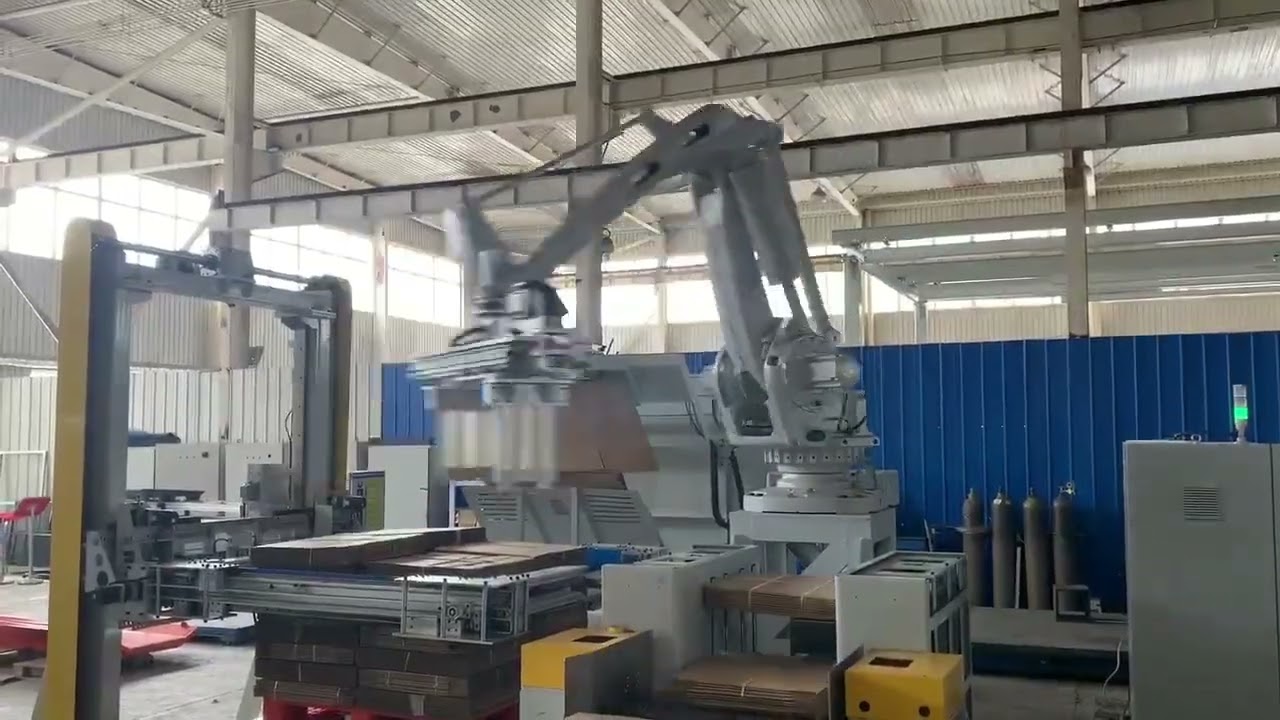 Cardboard robot palletizer with pallet dispensor bundle squaring pallet squaring and sheet feeder