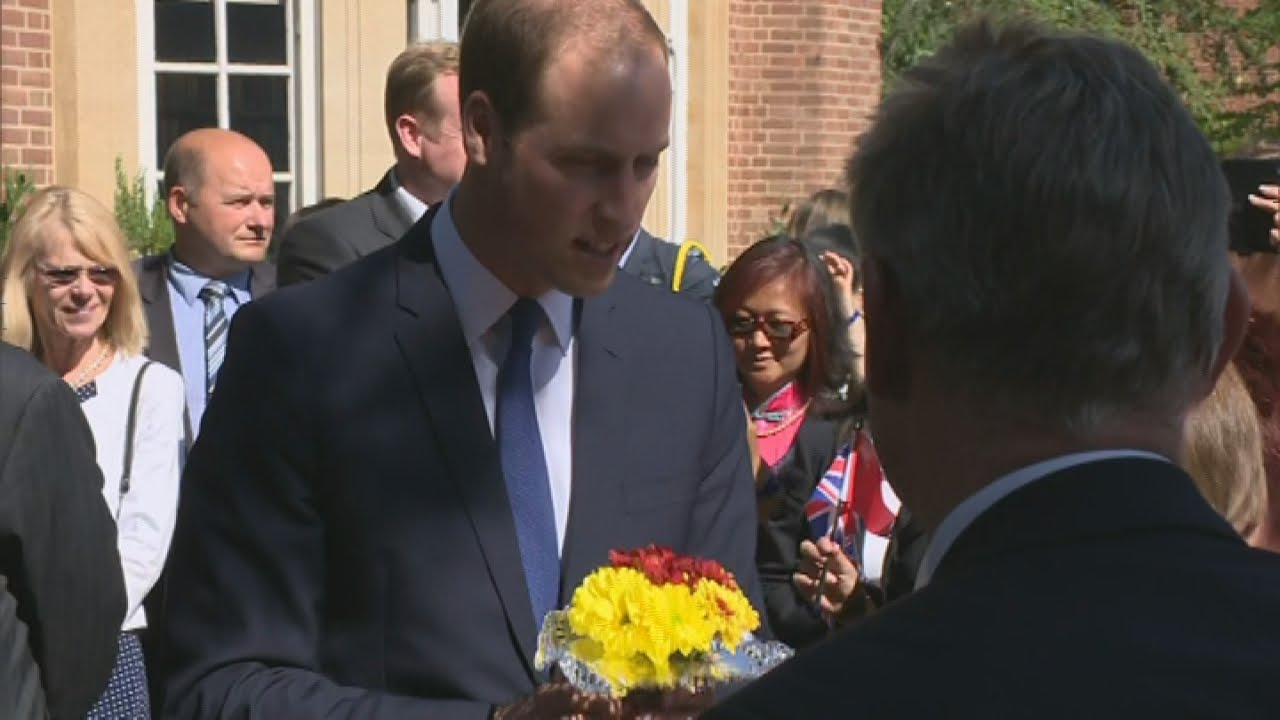 Prince William accepts flowers on behalf of pregnant Kate