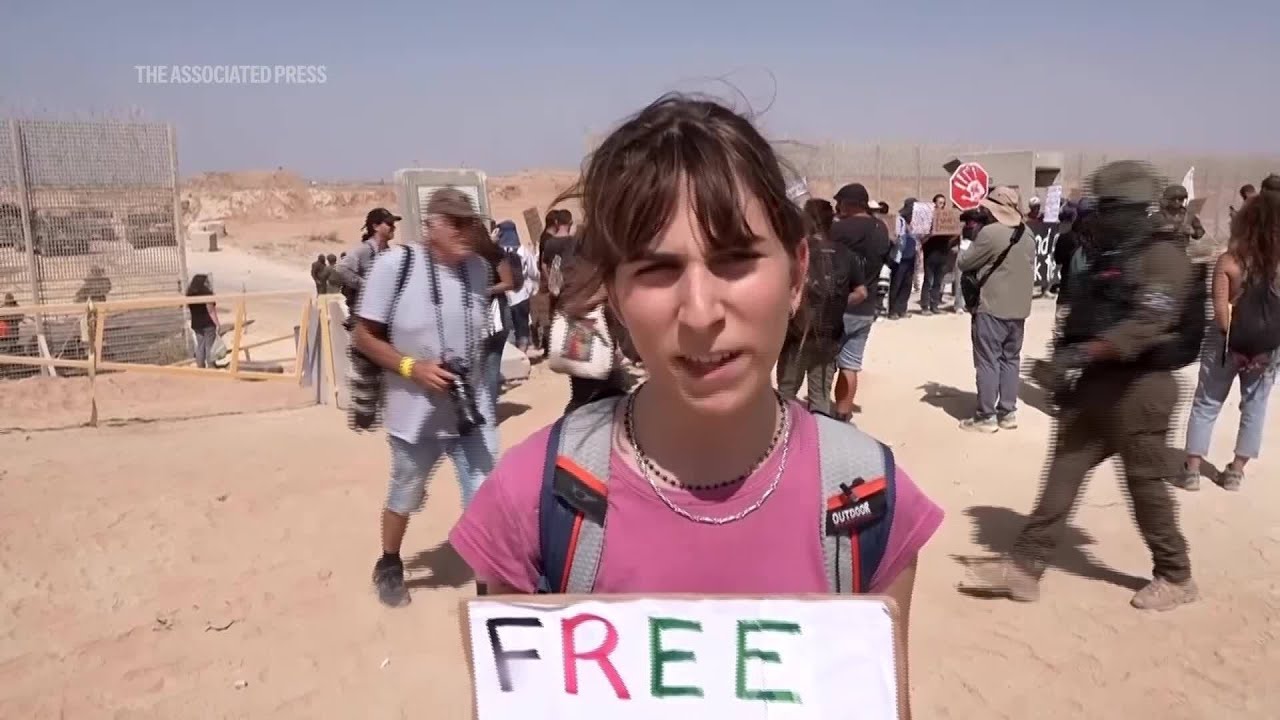 Israeli protesters block troops entering Gaza as they demand flotilla entry into enclave