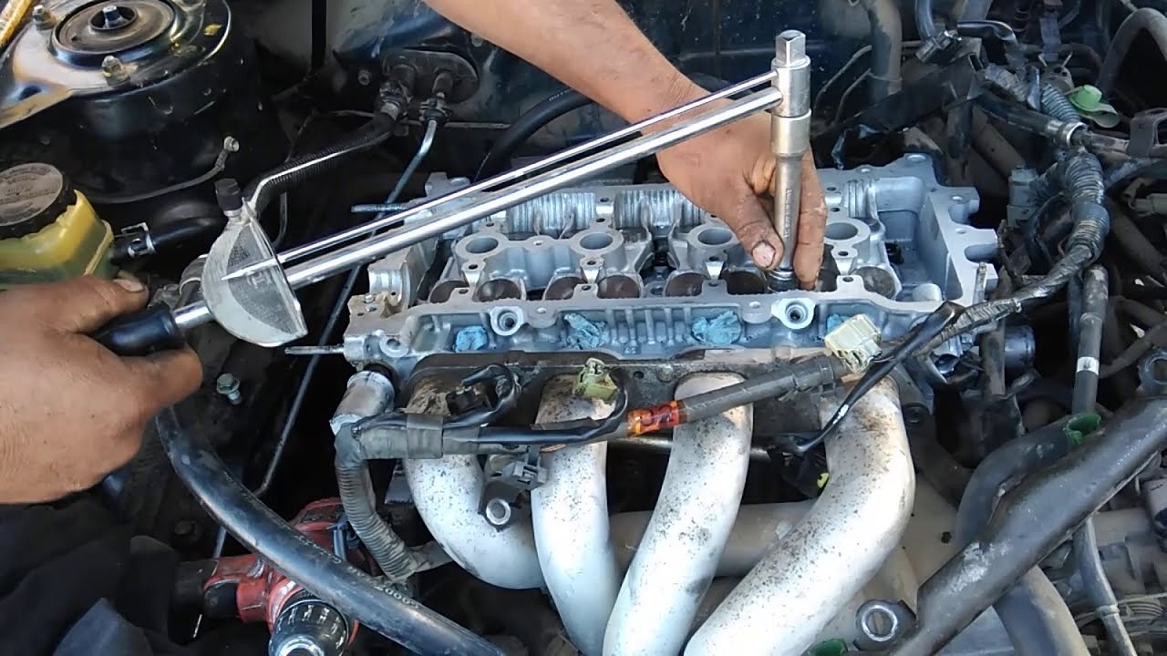 toyota corolla 2001 1.8pasos para calibrar los torniyos de la cabeza con un toqe de Abuja