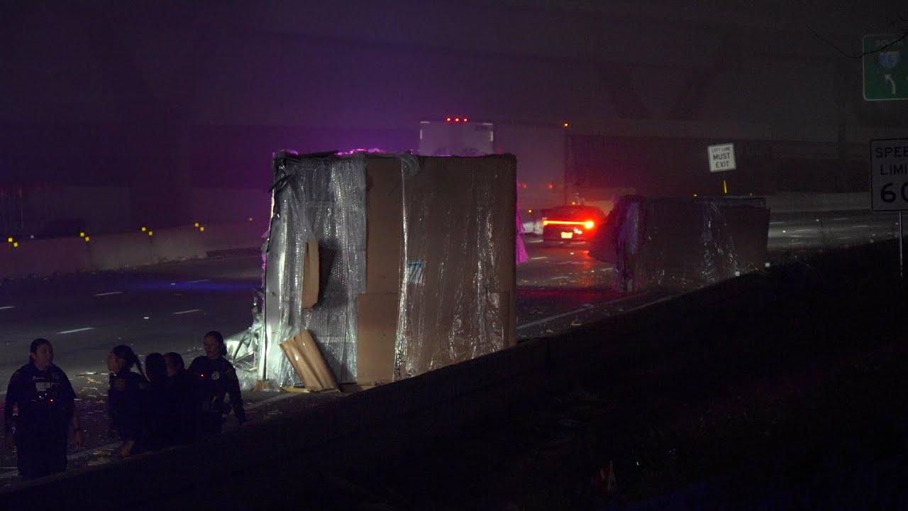 Boxes fall from truck after striking Houston Avenue Bridge on IH-10 Katy Freeway