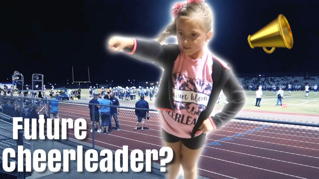 Is CHEERLEADING in her Future?? / Cutest 7 Year Old Performs at High School Football Game