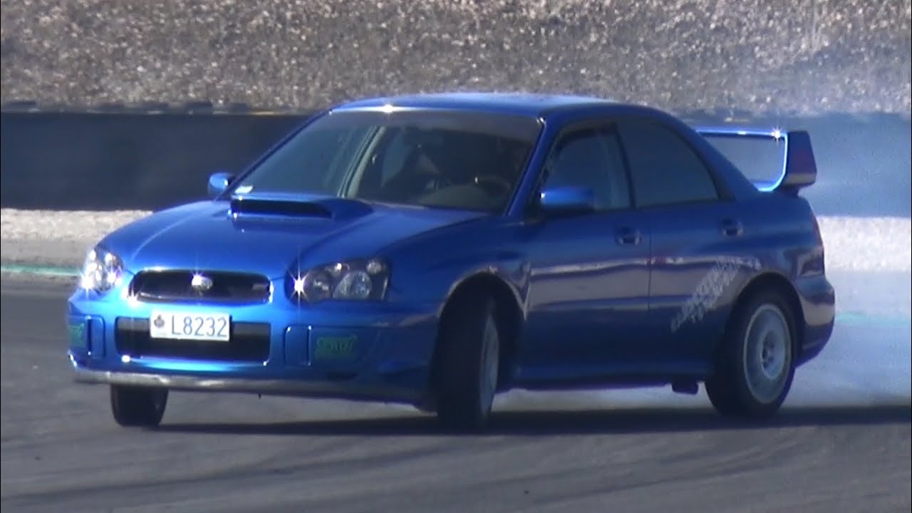 AWD Drift on Track! - Subaru Impreza WRX STI vs Lancer EVO X!