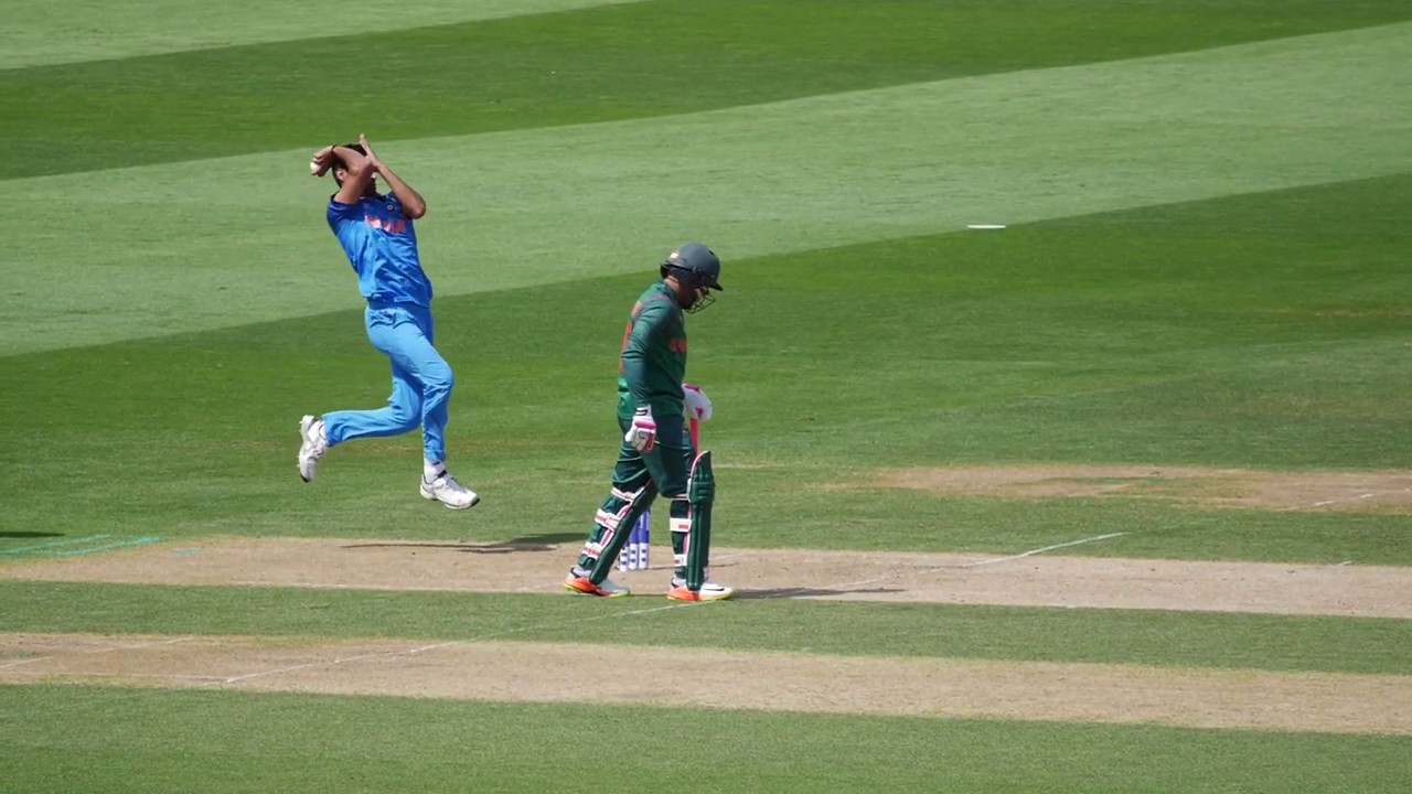 Right Arm Fast bowler (Bhuvi) front-on bowling action from side view in slo-mo
