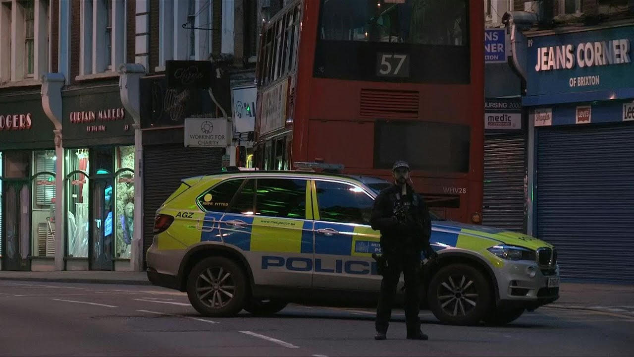 Police cordon off scene where police shot man in London after 'terror' stabbings | AFP