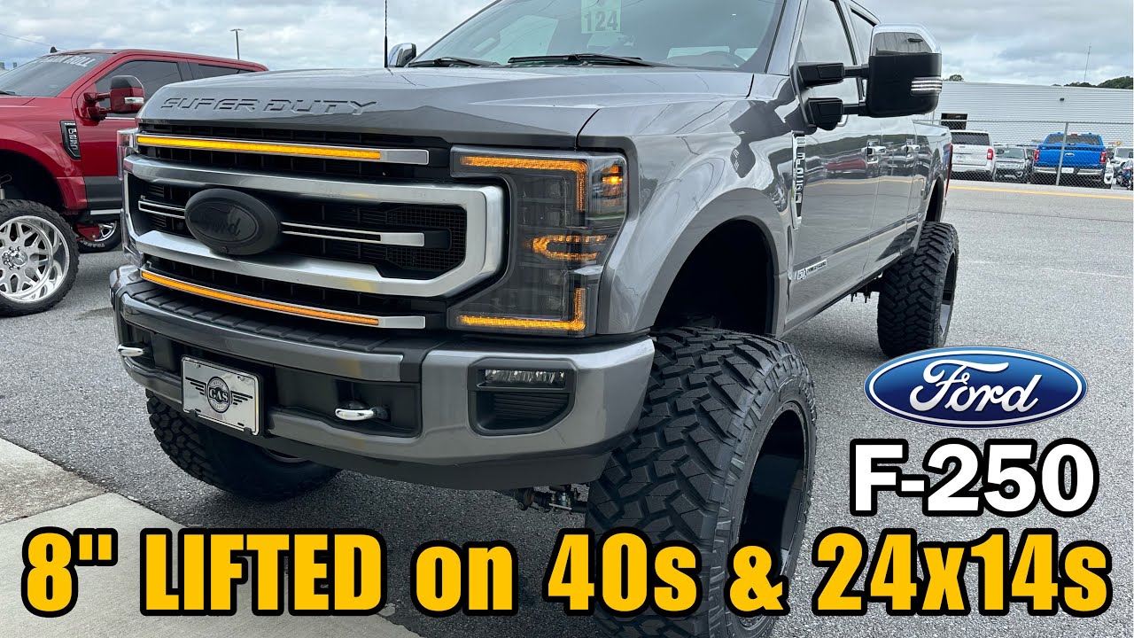 Ford F-250 Platinum 8 дюймов с приподнятыми дисками на 40-дюймовых дисках и 24x14-дюймовых дисках...