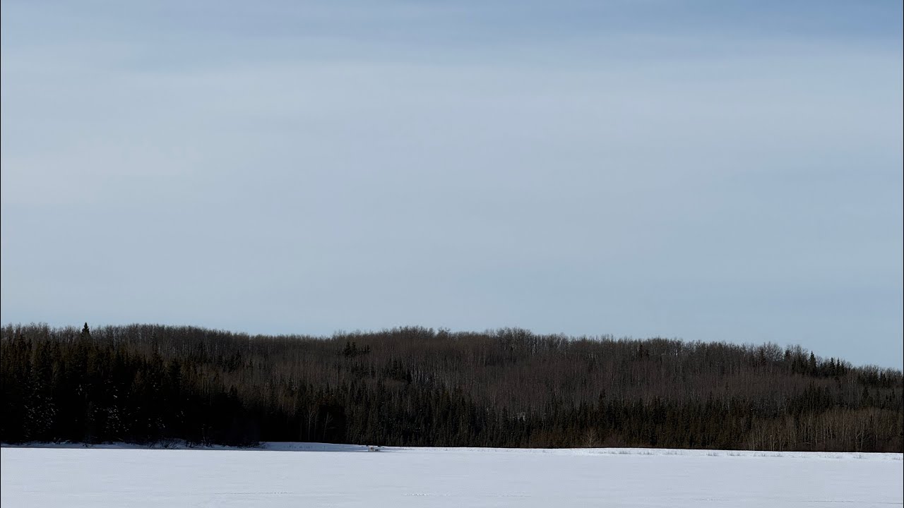 Fishing a remote foothills lake,in a wind storm.