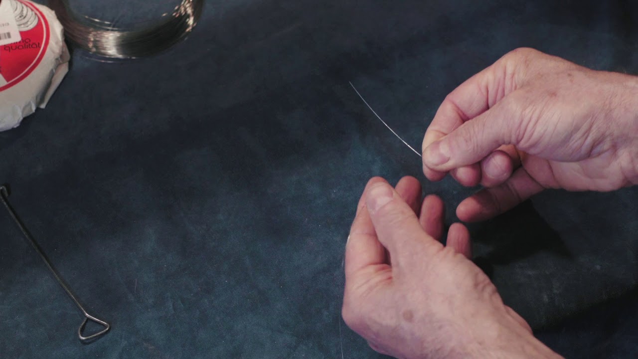 How to replace a sympathetic string or taraf on a sitar