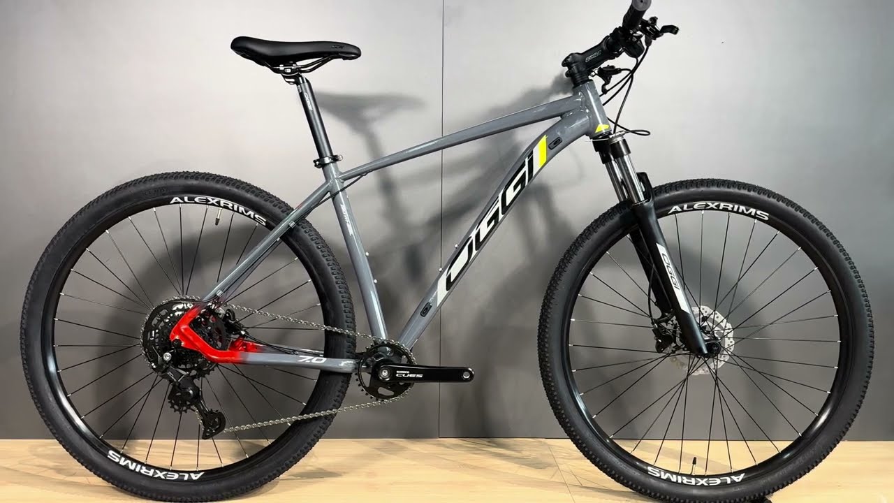 Bicicleta Oggi Big Wheel 7.0 2024 Shimano Cues Grafite/Vermelho/Amarelo