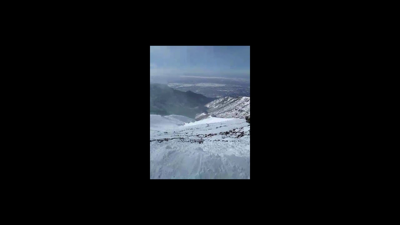 Skiing the top of Strawberry Express at Snowbasin Ski Resort north of Salt Lake City, Utah