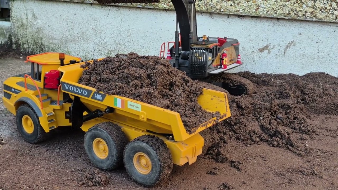 RC loader and excavator loading trucks 