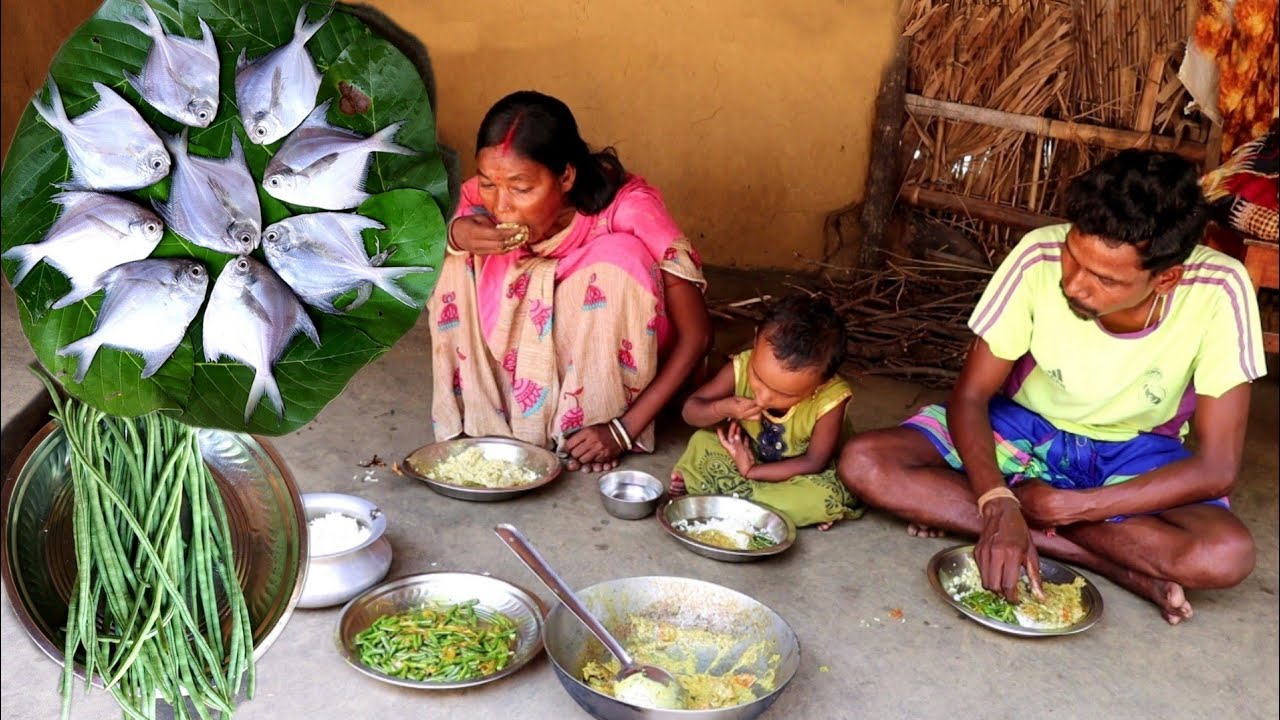 santali tribe mother cooking vegetable fry and pomfret fish curry for her family||rural village