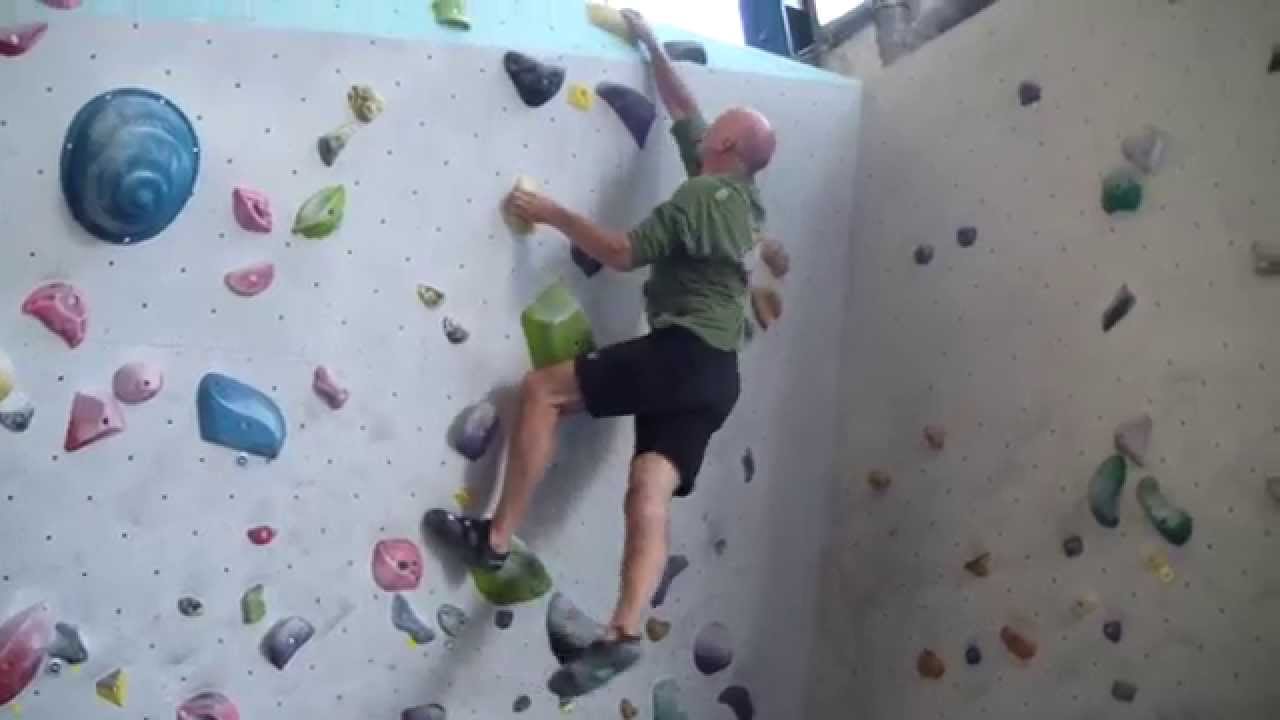 Climbing a 6A+ boulder route at Monk Amsterdam