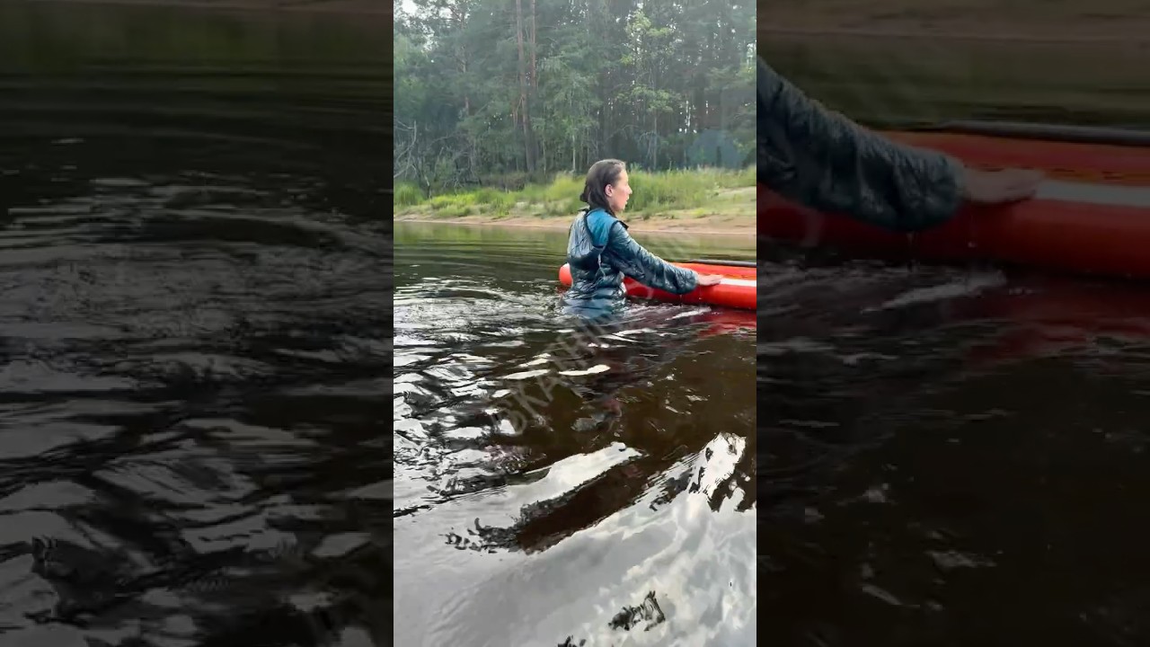 Sup board Beauty Lady catsuit shiny nylon Hunter boots taking swim fully clothed wetlook soaked