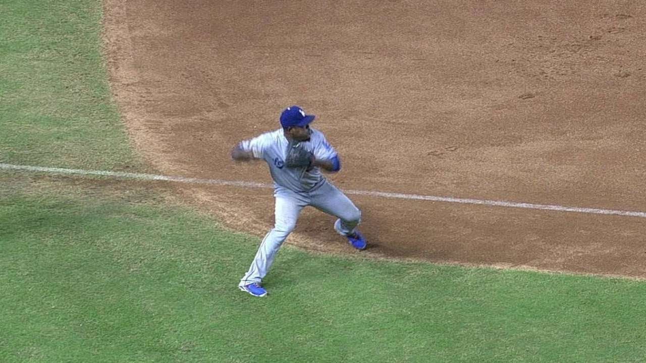 Uribe recovers with a strong throw to first