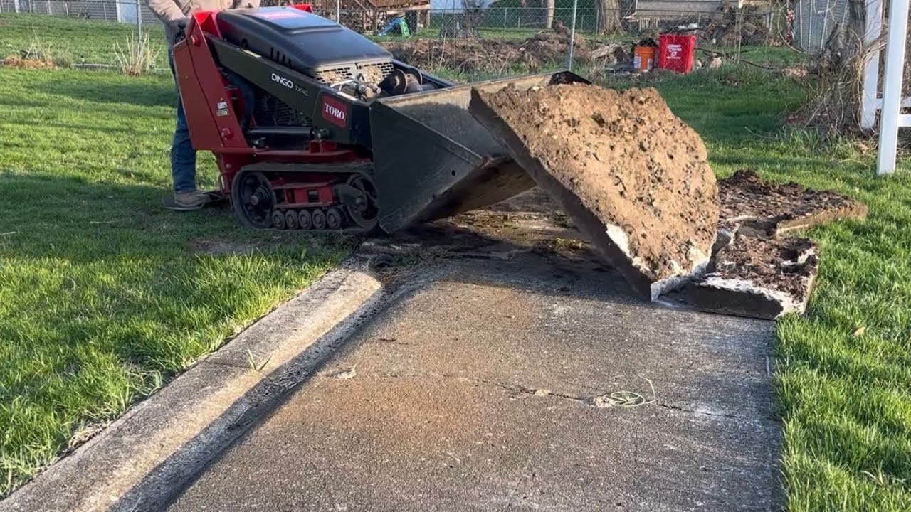 Toro Dingo ripping out a concrete slab, pergola, and a fence!