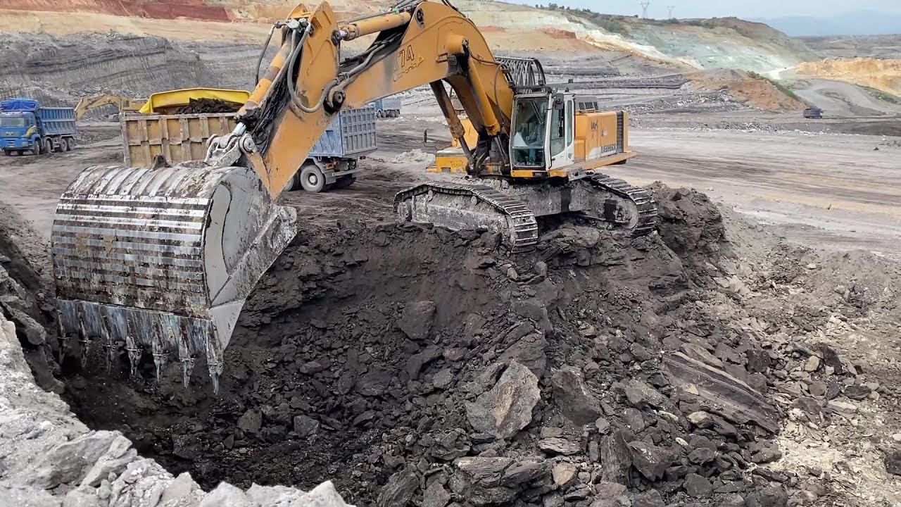 Liebherr 974 Excavator Loading Mercedes And MAN Trucks