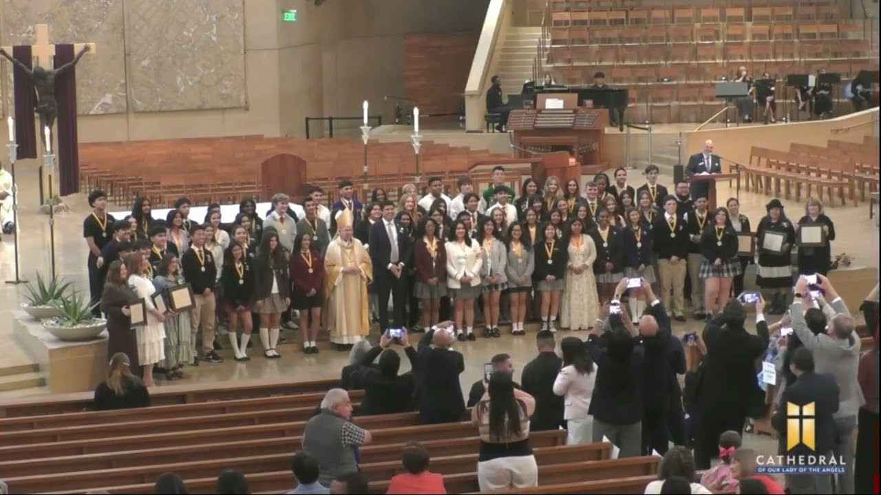 Catherine De Los Reyes and Christian Slamat awarded the Christian Service Award from LA Archdiocese