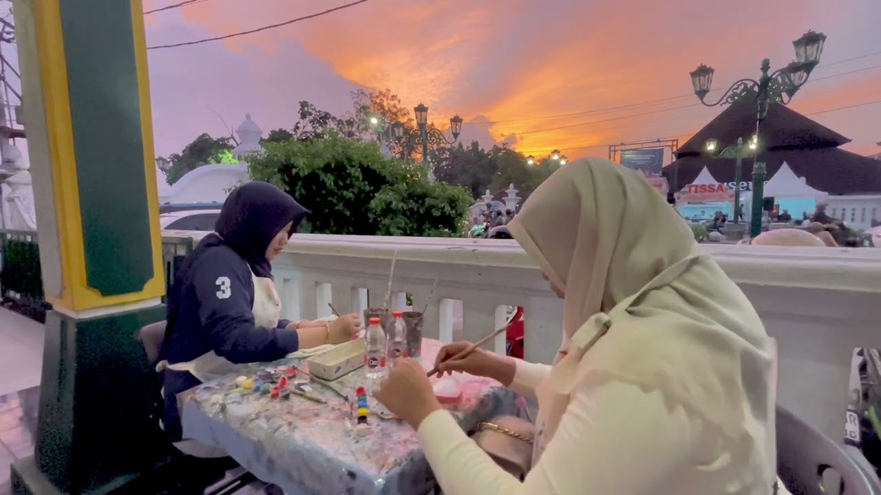 Painting while enjoying the sunset view.