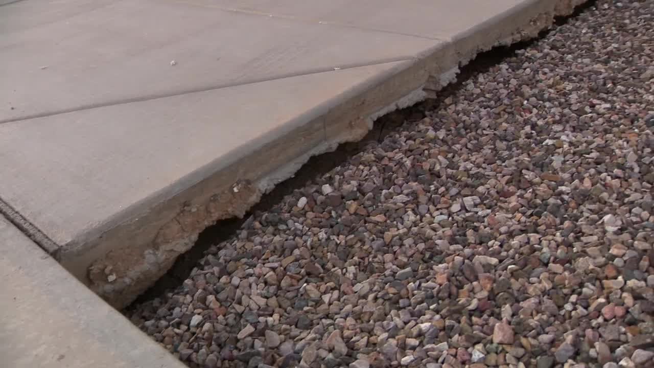 After storms, homeowners complain of sinking spots in their yards
