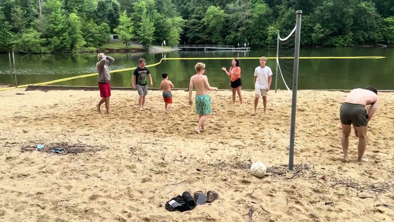 We playing volleyball at beach  summer camping