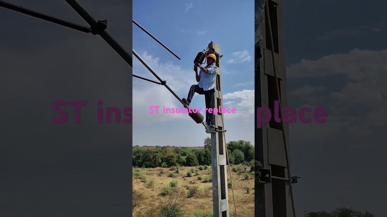 Railway staff replace St insulator under power block...