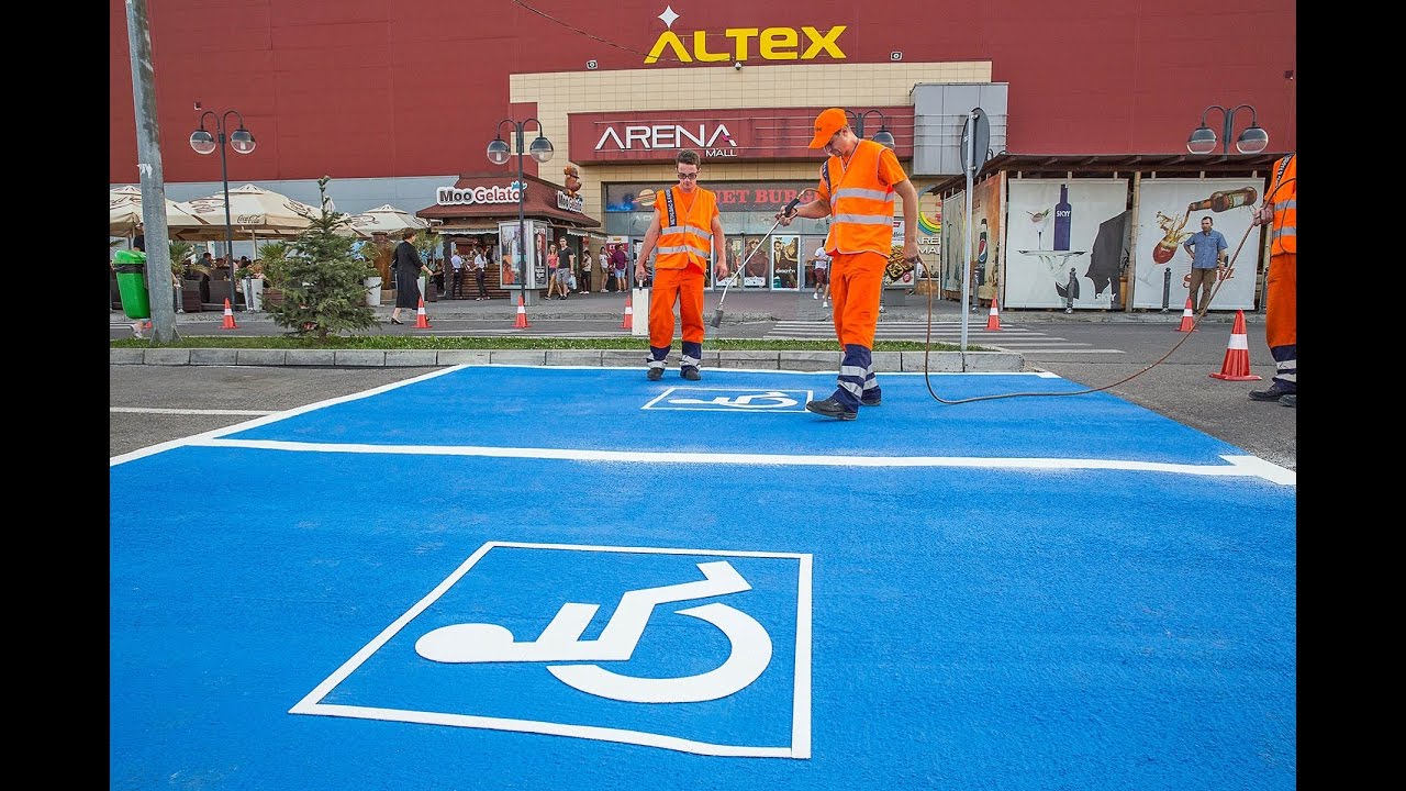Road markings for parking spaces, applied with 2K Cold-Plastic and preformed thermoplastic
