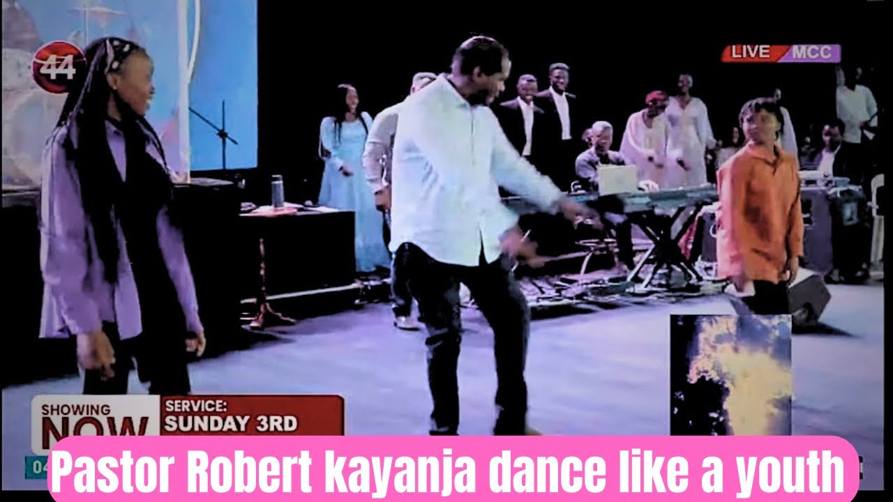 Pastor Robert kayanja dancing like a 17 young  boy with two young girls 