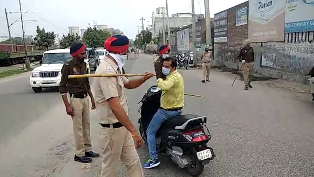Watch police weild the stick on curfew violators in Punjab
