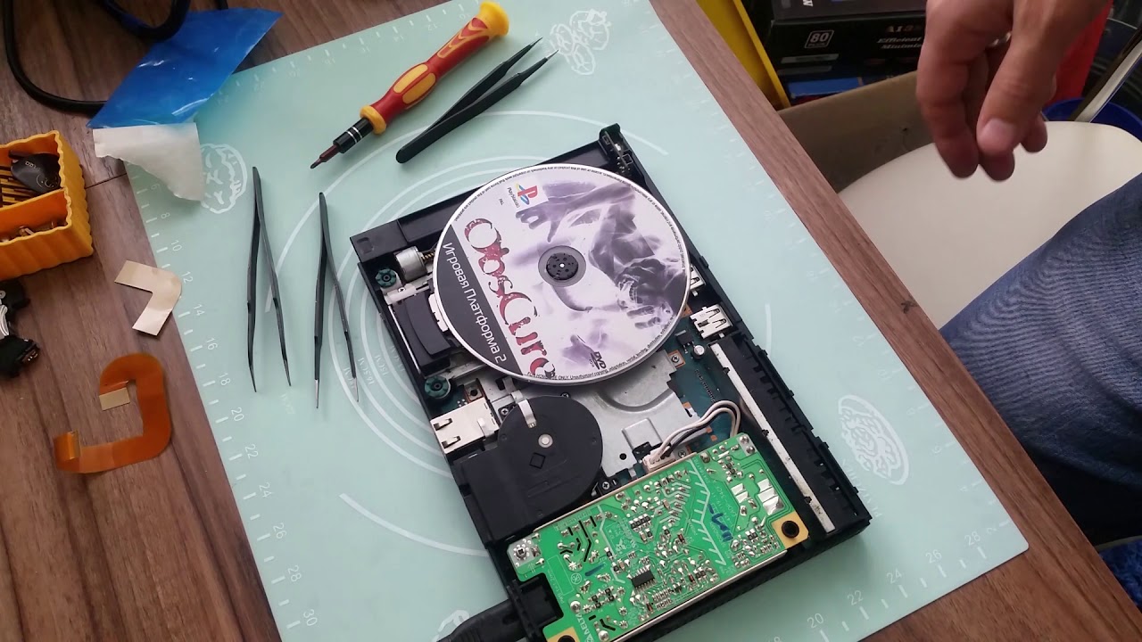 PlayStation 2 не читает диски и трещит моторчик