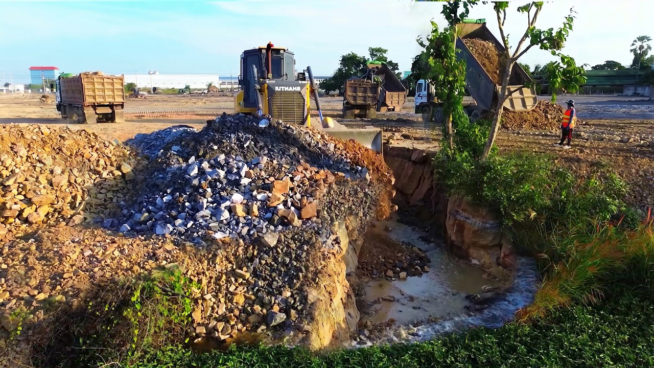 Unbelievable SHANTUI Dozer Power Filling a Massive Land Sink With Rocks With Dump Trucks