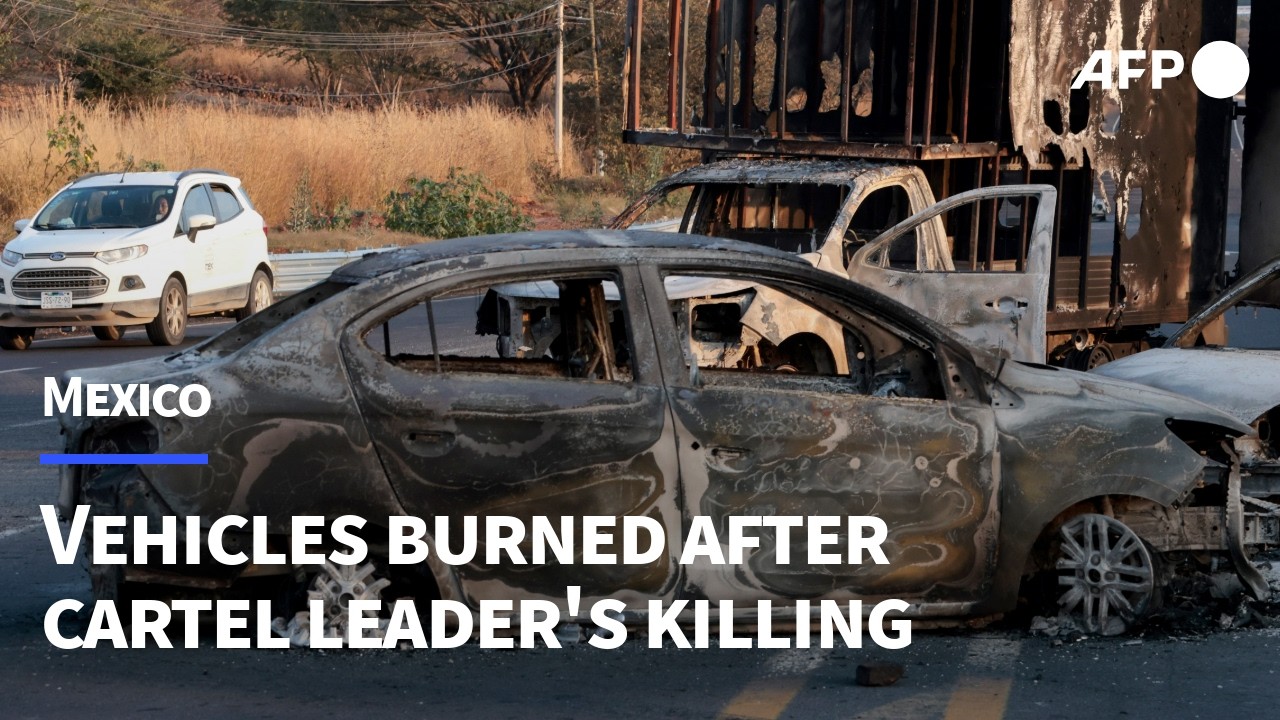 Burned vehicles near US-Mexico border after drug kingpin killing | AFP