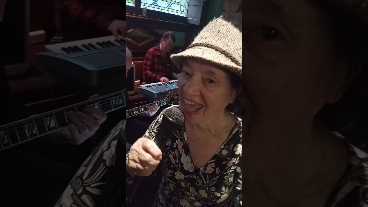 The 85 year old June singing  in a Glasgow pub on a Tuesday afternoon.